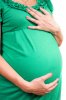 belly-of-a-pregnant-girl-in-green-dress-isolated.jpg