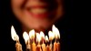 stock-footage-happy-young-woman-blows-out-birthday-candles.jpg