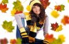 5429747-beautiful-girl-wearing-hat-and-gloves-and-maple-leaves.jpg