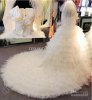 designer-wedding-dress-2013-empire-bow-feather.jpg