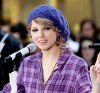 taylor-swift-rock-center-blue-beanie-purple-shirt-fashion.jpg