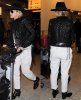 rita-ora-heathrow-january-2014-saint-laurent-chain-boots-2-horz.jpg