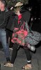 miley-cyrus-enters-club-fully-clothed-leaves-in-bra-03.jpg