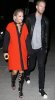 rita-ora-calvin-harris-gladiator-knee-high-sandals-orange-coat.jpg