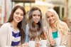 three-beautiful-girls-drinking-coffee-cafe-holidays-food-tourism-concept-35976349.jpg