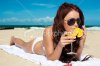 istockphoto_15463306-young-woman-drinking-cocktail-on-the-beach.jpg