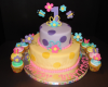 Trendy girl first birthday cake with first birthday cupcakes pictures.PNG