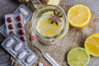 maison-jar-ginger-lemon-tea-pills-thermometer-wooden-background-69417532.jpg