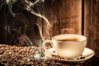 a-cup-of-hot-coffee-with-coffee-beans.jpg