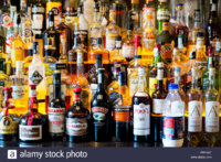 hard-alcohol-bottles-in-a-bar-FFFKGT.jpg