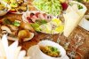 7696824-dining-table-with-a-great-abundance-of-different-food.jpg