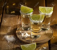 37987144-gold-tequila-shots-with-lime-fruits-on-wooden-background.jpg