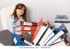 stock-photo-tired-accountant-working-overtime-in-the-office-workplace-81932734.jpg