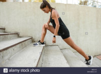 portrait-of-a-fitness-woman-doing-stretching-exercises-on-stairs-outdoors-M0XKY5.jpg