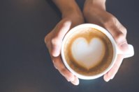 a-woman-holding-a-cup-of-coffee-1024x683.jpg
