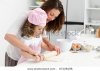 stock-photo-mother-and-daughter-using-a-rolling-pin-together-in-the-kitchen-67108198.jpg