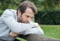 sad-and-lonely-man-in-troubles-seated-on-a-park-bench-KG77JF_1.jpg