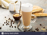 hot-coffee-latte-with-brown-sugar-and-biscotti-cookies-in-tall-glass-HPJ5AD.jpg