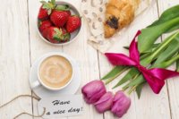 cup-coffee-tulips-croissant-strawberries-have-nice-day-massage-wooden-background-121070597.jpg