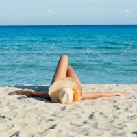 17374637-young-woman-relaxing-and-sunbathing-at-beach.jpg