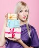 8216428-portrait-of-beautiful-blonde-party-girl-with-birthday-gift-box-on-pink.jpg