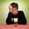 10024262-drunk-man-at-the-pub-table-with-a-glass-of-cold-light-beer.jpg