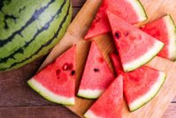 fresh-ripe-watermelon-slices-on-wooden-table-royalty-free-image-1684966820.jpg